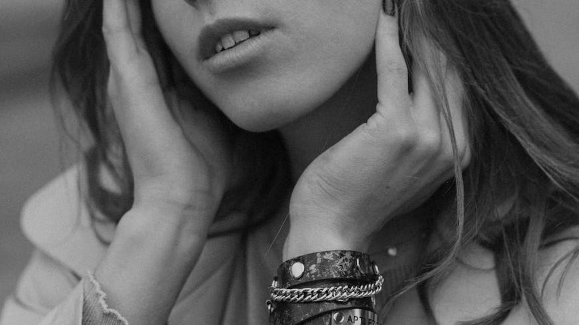 Silhouette of a person in a serene yoga pose against a soft background.